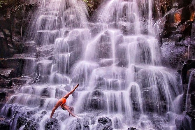 Tanah Lot Temple, Waterfall & Ubud Tour (Private & All-Inclusive) - Kanto Lampo waterfall: black rock scenery and a timed nature break
